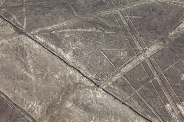 Aerial view of lines and patterns on a dry desert surface, the geoglyphs and drawings in the desert near Nasca and Palpa in Peru