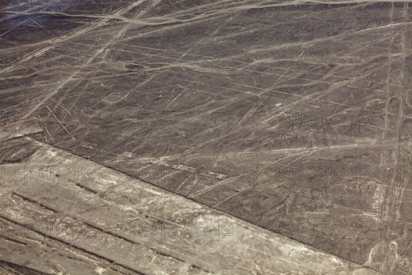 Geoglyphs of the Nazca Lines in a desert-like area with recognizable patterns, The geoglyphs and images in the desert near Nasca and Palpa in Peru