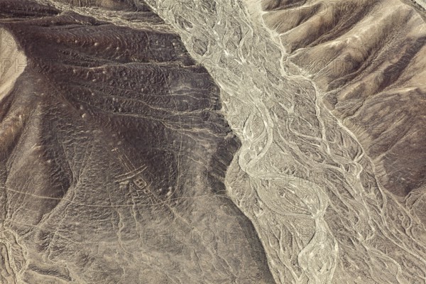 Ancient lines and patterns in a dry desert landscape, the geoglyphs and drawings in the desert near Nasca and Palpa in Peru