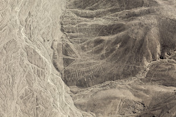 View of lines and geometric patterns drawing the barren landscape, the geoglyphs and drawings in the desert near Nasca and Palpa in Peru