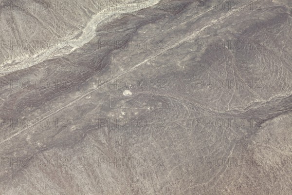 Visible lines and patterns in a barren, dry desert region, the geoglyphs and images in the desert near Nasca and Palpa in Peru