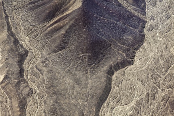 Patterns in a sandy, dry desert landscape with geoglyphs, the geoglyphs and drawings in the desert near Nasca and Palpa in Peru