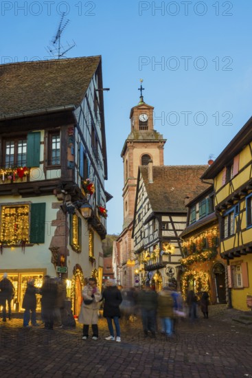 Colour-illuminated and Christmassy decorated half-timbered houses, blue hour, Christmas market, Riquewihr, Grand Est, Haut-Rhin, Alsace, France