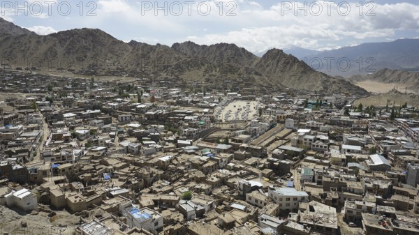 City view from Leh Palace over Leh with mountains and cloudy sky, Ladakh, North India, Himalayas, India