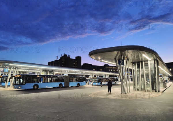 Bus station in the early morning right next to Wuppertal main station, public transport connection, North Rhine-Westphalia, Germany