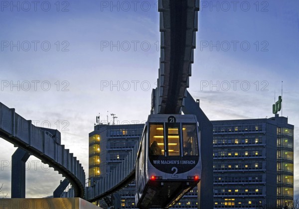 The H Bahn, an automatically controlled large cabin suspension railway in front of the Mathetower on the North Campus of TU Dortmund, Dortmund, Germany