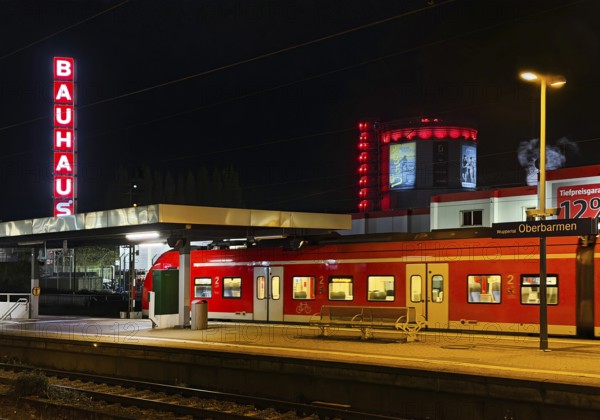 Local train at Oberbamen station with gas boiler at night, Wuppertal, North-Rhine Westphalia, Germany