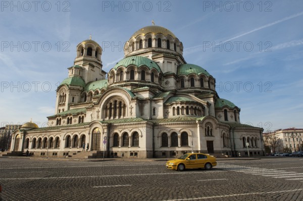 Sofia, Bulgaria, February 6th 2018 Bulgarian Taxi passing Alexander Nevsky Cathedral, Sofia. Bulgaria