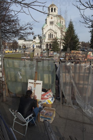 Sofia, Bulgaria, February 6th 2018 Artist painting religious image outside Alexander Nevsky Cathedral, Sofia. Bulgaria