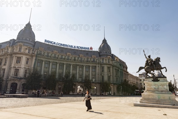 Bucharest, Romania. October 29th 2023. A woman walks past the Banca Comerciala Romana, (BCR) a commercial bank in Romania providing retail, corporate and investment banking