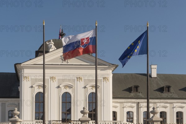 Bratislava, Slovakia. October 3rd 2023 Slovak and EU flags fly outside The Grassalkovich Palace. The official residence of the President of the Republic of Slovakia