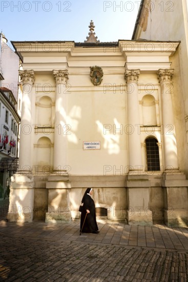 Bratislava, Slovakia. October 2nd 2023 A Nun walking towards the Franciscan Church, Old Town, Bratislava, Slovakia