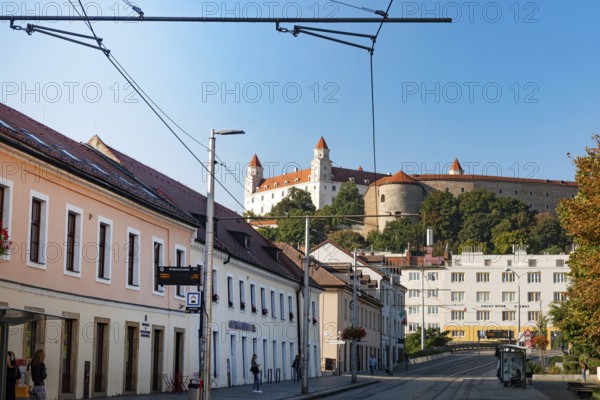 Bratislava, Slovakia. October 2nd 2023 Bratislava Castle overlooking the Little Carpathians directly above the Danube River, seen from Zupne Namestie Square in the Old Town of Bratislava, capital of Slovakia