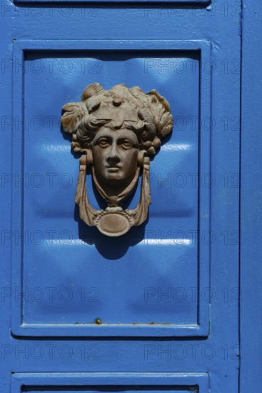 Bodrum, Mugla, Turkey. April 22nd 2022 Beautiful blue door with a Greek mythological icon as a door knocker in the historical coastal city of Bodrum in the Aegean region of Turkey