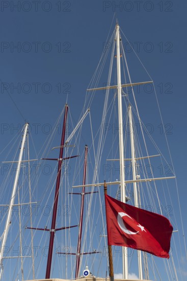 Dramatic abstract view of the masts of sailing boats in a Turkish harbour on the Aegean Sea in Southwest Turkey