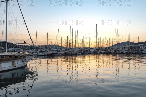 Bodrum, Turkey. April 23rd 2022 Beautiful sunset yachts moored in Bodrum Harbor, Turkish Aegean coast of Turkey