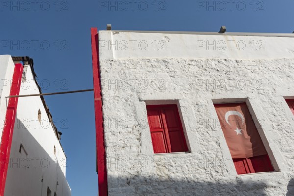 Bodrum, Mugla, Turkey. April 22nd 2022 Graphic architecture and red shuttered windows of traditional buildings in the western Turkish city of Bodrum, Turkey