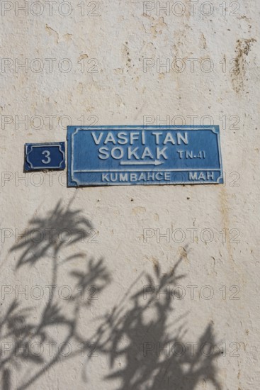 Bodrum, Turkey. April 23rd 2022 Pretty blue street sign with shadows, a typical traditional lane in Bodrum Old Town, Turkish Aegean Coast, Turkey