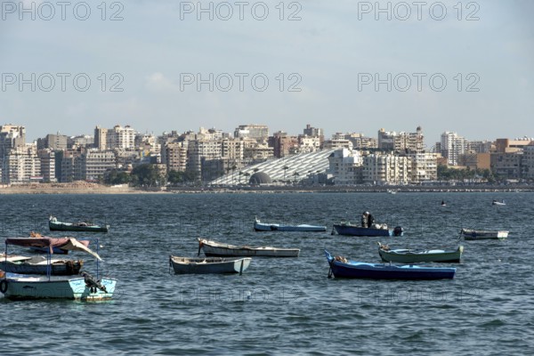 Alexandria, Egypt. December 3rd 2022 Local fishermen and fishing boats moored in the Mediterranean harbour of the Egyptian Delta port city of Alexandria, Egypt