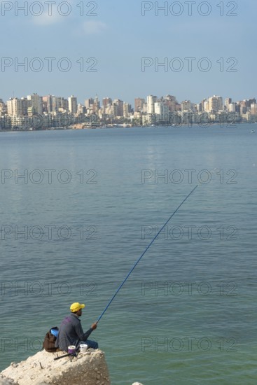 Alexandria, Egypt. December 1st 2022 A local fisherman on the Mediterranean coastal city of Alexandria, Egypt, including copy space for cover image