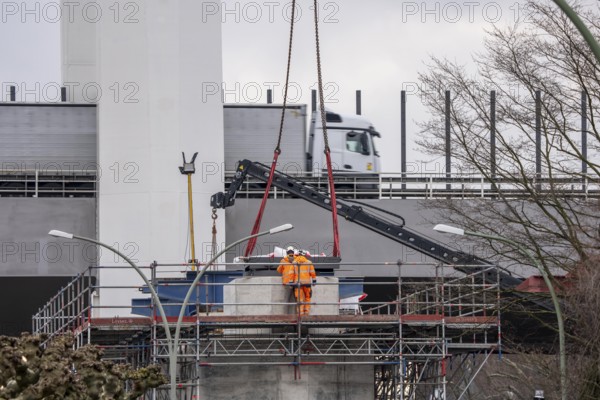 Duisburg-Neuenkamp Rhine bridge, the A40 motorway, construction of the second bridge begins, bridge pillars are being built on the Du-Homberg side of the Rhine, truck on the completed first section of bridge, North Rhine-Westphalia, Germany