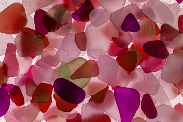 Red broken glass cut by the sea, sea glass, sea glass, beach glass from the North Sea