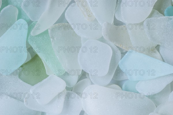 Pastel-coloured glass shards smooth by the sea, sea glass, sea glass, beach glass from the North Sea