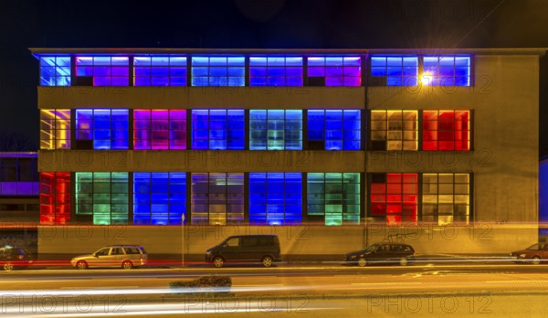 Colourfully illuminated window front in a Frankfurter Mainova AG building, city center, Frankfurt am Main, Hesse, Germany