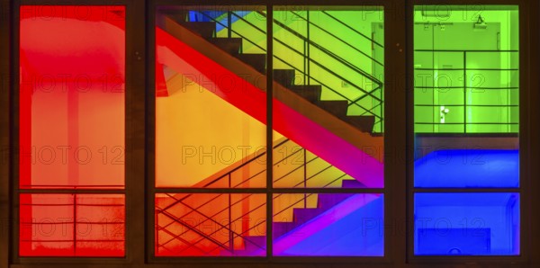 View through the windows of a brightly lit staircase. Frankfurter Mainova AG building, city center, Frankfurt am Main, Hesse, Germany