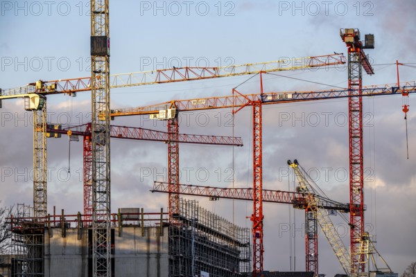 Construction cranes on 2 large construction sites Wohnbau, Geschäftsgebäude, Krefeld North Rhine-Westphalia, Germany