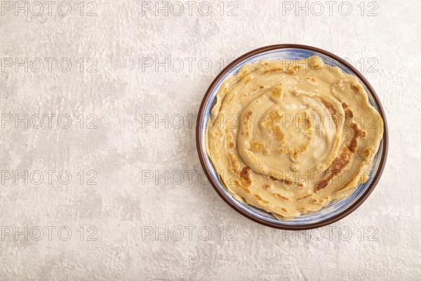 Stack of Plain Fried pancakes on gray concrete background. top view, flat lay, copy space