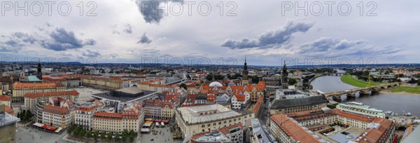 Bird's eye view of Dresden with red roofs and Elbe, under a cloudy sky, Dresden
