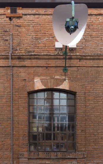 Brick building with factory window of gondolas, Giudecca, Ventien, Italy