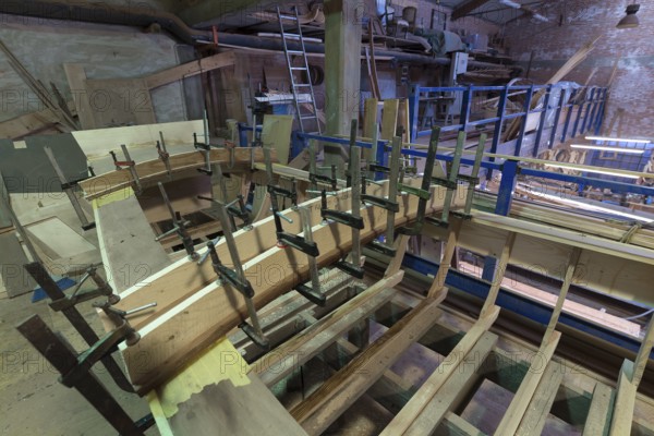 Gluing a boat hull, shipyard on the Giudecca, Veneto, Italy