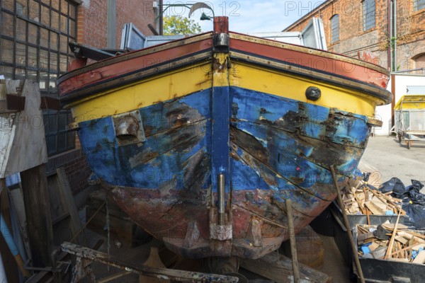 Old barge at a shipyard, Italy