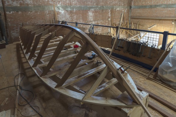 Construction of a commercial boat for Venice in a shipyard, Giudecca, Veneto, Italy