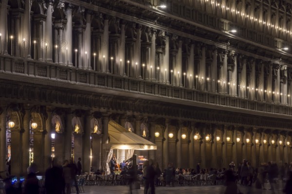 Authorized parties in a nocturnal atmosphere with music band on St. Mark's Square, Venice, Veneto, Italy