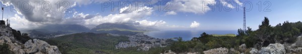 Panoramic view from Calis Tepe in Kemer of a coastal region with mountains, sea and dramatic clouds, Kemer, Turkey