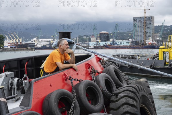 Batumi, Georgia. July 21st 2025. A local worker at Batumi Port, largest container, ferry, general shipping and cargo seaport on the Black Sea coast of Georgia