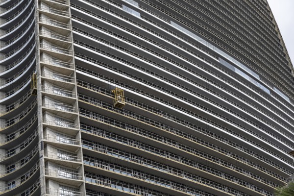 Batumi, Georgia. July 21st 2025. A construction worker working on a modern high-rise building project along the sea front of Batumi on the Black Sea coast of Georgia