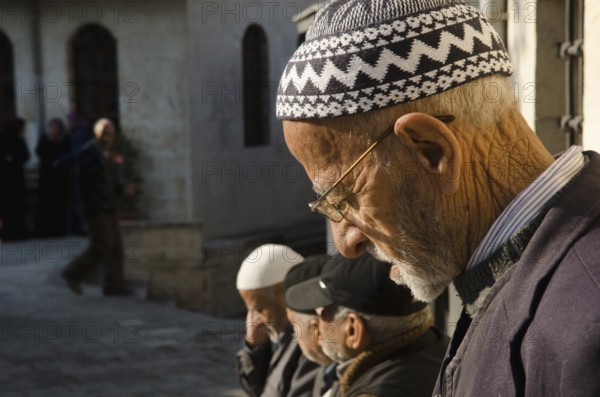 Antakya, Turkey. December 21st 2013 Old Turkish men in the courtyard of a mosque in Antakya, Turkey