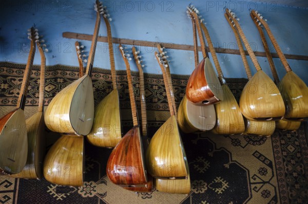 Adana, Turkey. June 9th 2014 Traditional Turkish Saz or Baglama a long necked Lute musical instrument hanging inside a shop in the Anatolian city of Adana