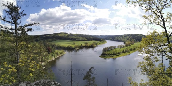 An impressive view of the meandering Saale between green hills and forests, hiking in the Thuringian Forest nature park Park