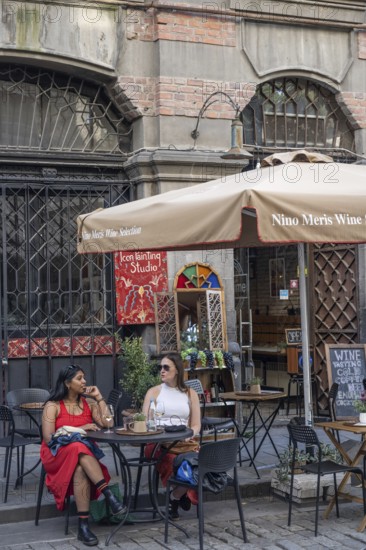 Tbilisi, Georgia. September 12th 2025 Enjoying a glass of Georgian wine outside a wine bar café in the Old Town of Tbilisi, Georgia