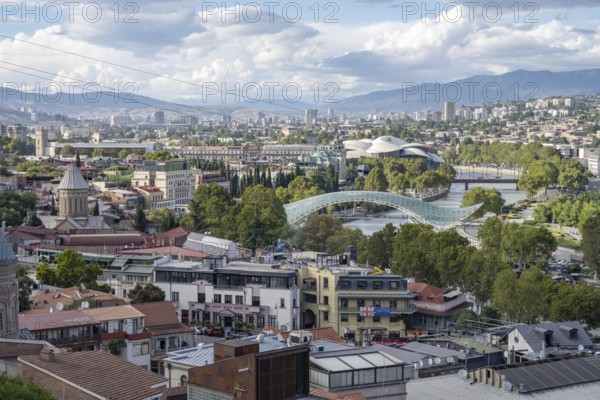 Tbilisi, Georgia. September 12th 2025 Panoramic city view of Tbilisi, the Georgian Capital with its modern architecture and Bridge of Peace over the Kura River and Rike Park. Georgia