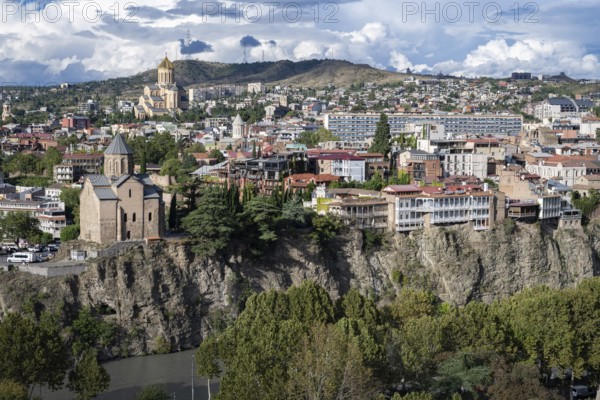 Tbilisi, Georgia. September 12th 2025 Dramatic cliff side view of Tbilisi with the Metekhi Church of the Nativity and the Virgin Mary overlooking the Mtkvari or Kura River, Georgia