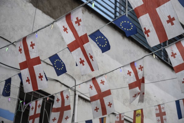 Tbilisi, Georgia. September 15th 2025. Flags of Georgia and the European Union fly side by side in a side street near Freedom Square in Tbilisi, Capital of Georgia