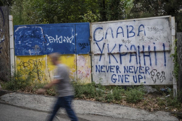 Tbilisi, Georgia. September 15th 2025. Graffiti saying Glory to Ukraine and the flag of Ukraine painted on a wall in downtown Tbilisi, Georgia