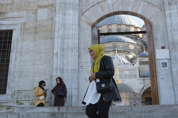 Istanbul, Turkey. January 3rd 2025. Muslim women outside the entrance to the newly restored Yeni Camii or New Mosque in the Eminonu district of Fatih, Istanbul, Turkey
