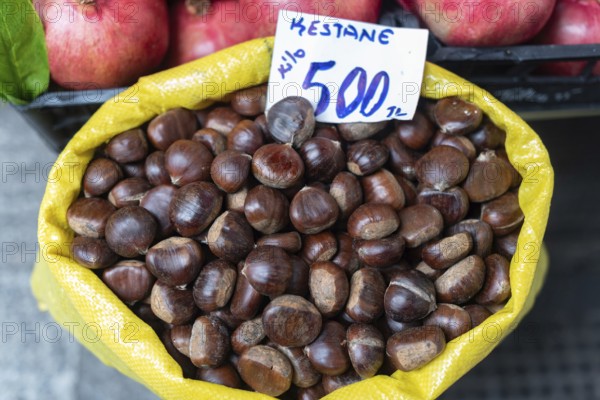 A sack of chestnuts known as Kestane in Turkish for sale in a popular shopping bazaar in Istanbul, Turkey